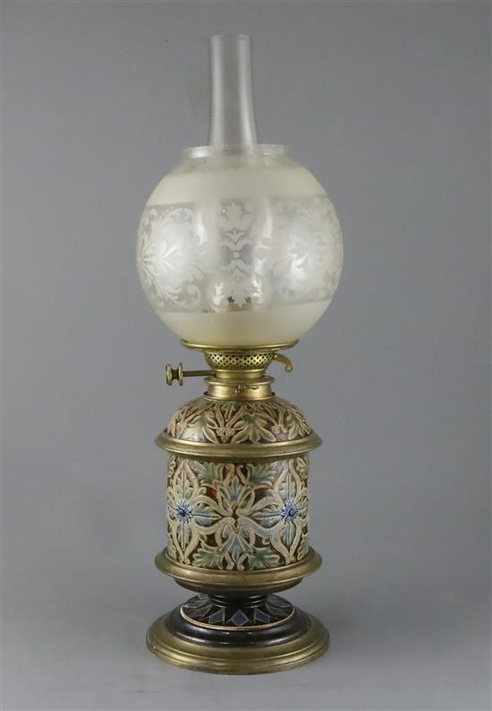 Arthur E. Pearce and John Huskinson for Doulton Lambeth, an incised foliate oil lamp, dated 1879, height 33.5cm to brass burner excludi
